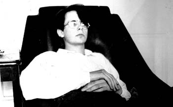self portrait in cheap chair 1990